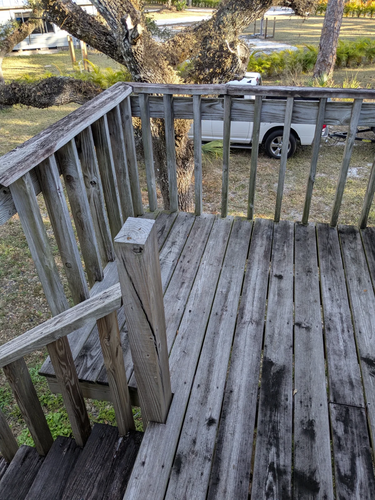 Weathered wooden deck with railing