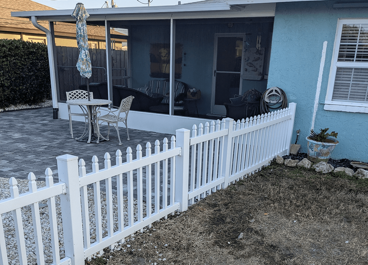 Patio with white fence and garden