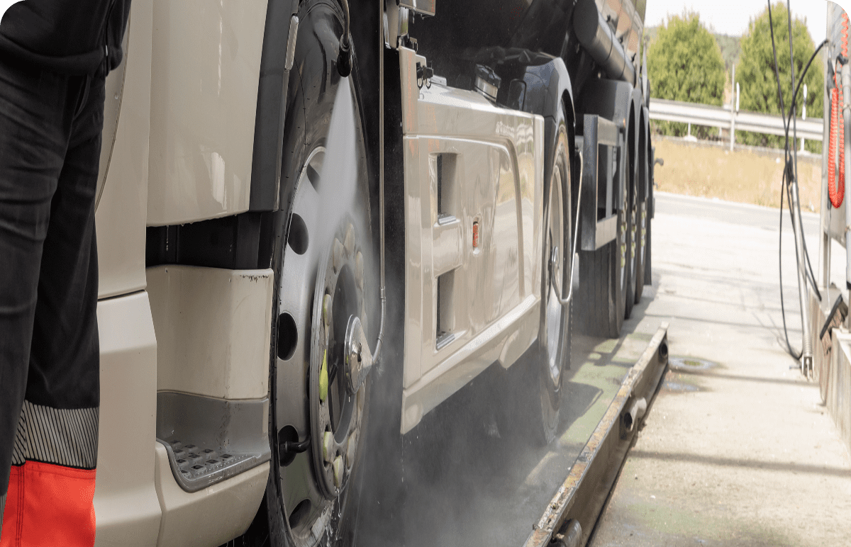 Close-up of truck tire cleaning process.