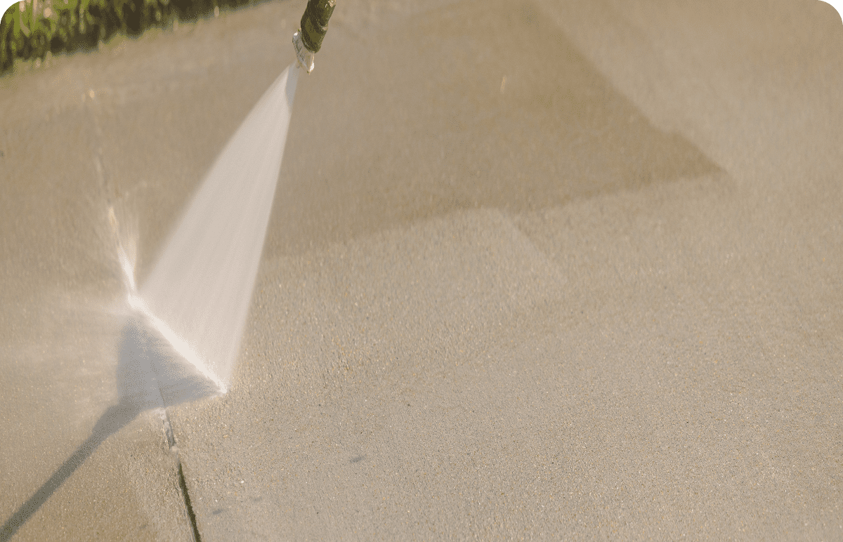Pressure washing concrete surface